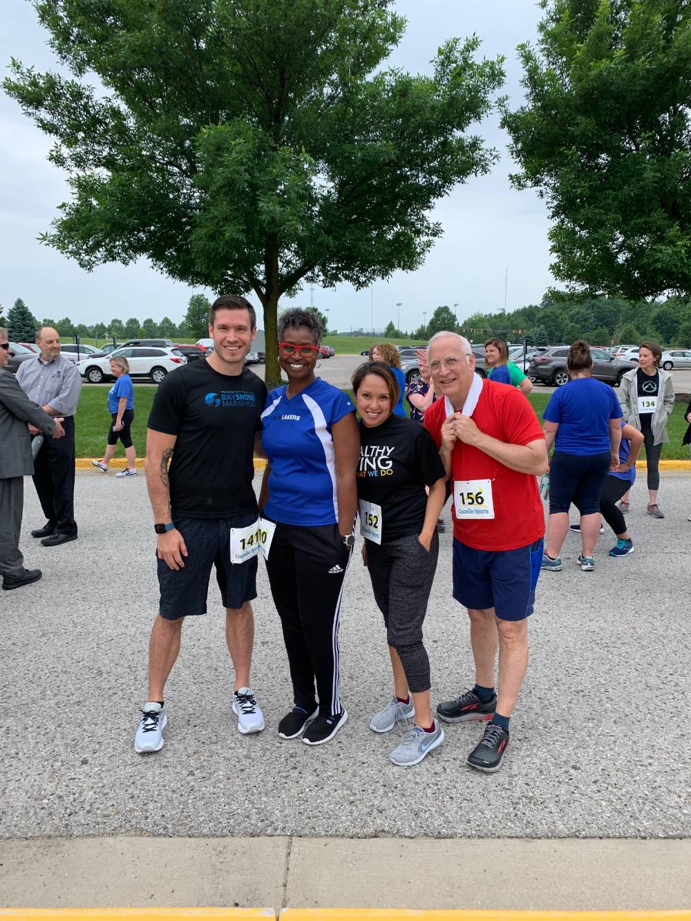 Adam MacRae, Tara Bivens, Elisa Salazar and Dave Smith standing together and smiling before the race